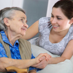 Senior woman with her home caregiver